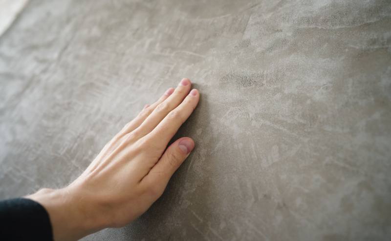 Inspecting Concrete Before Applying Cement Stain