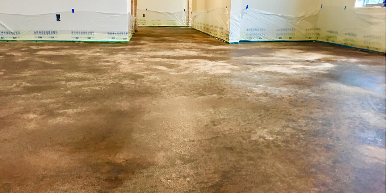 residue forming on stained concrete floor
